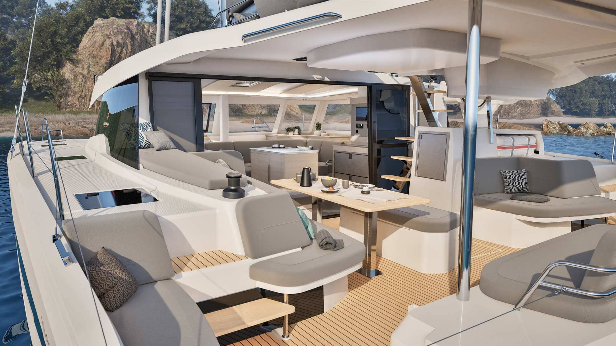 Saloon with table and sofa in gray fabric on board a catamaran.