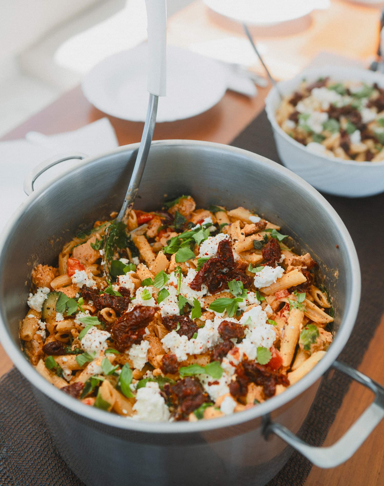 A creamy pasta salad with sun-dried tomatoes and cheese